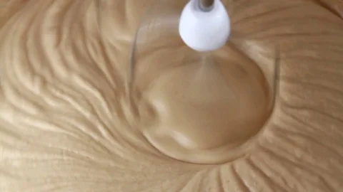 Mixing ingredients for coffee mousse Video stock 72408643