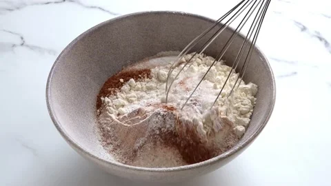 Mixing ingredients for dough Stockbeeldmateriaal 234439365