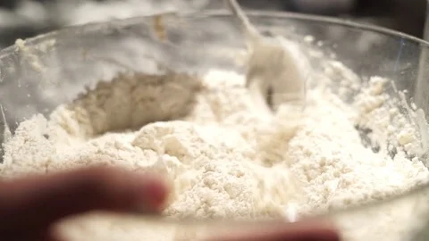 Mixing ingredients for dough with a spoon Video stock 75352121