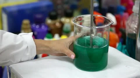Mixing liquid in beaker Stock Footage 24652575