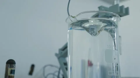 Mixing Liquid In Beaker In A Laboratory Video stock 61457694