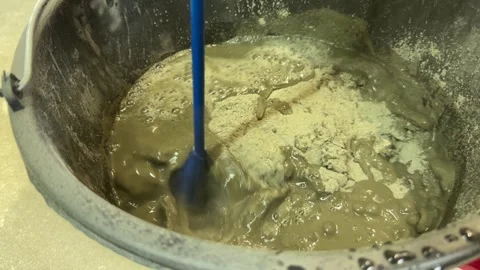Mixing liquid cement for construction, mixed in a large container Video stock 331569166