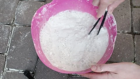 Mixing liquid with plaster. DIY creative process tutorial. Stock Footage 316920619