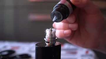 Mixing liquid for vaping using pipette closeup. Stock Footage 85993721