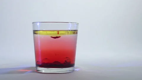 Mixing of liquids in a glass or dissolution 10 Stock Footage 99735979