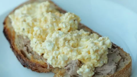 Mixing Mashed Boiled Eggs with Cottage Cheese and Mayonnaise Stock Footage 343733661