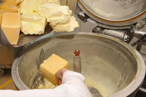 Mixing mass for the production of processed cheese. Cheese production Stock Photos