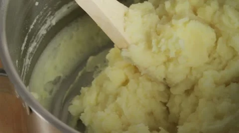 Mixing milk into mashed potato Stock Footage 24666223
