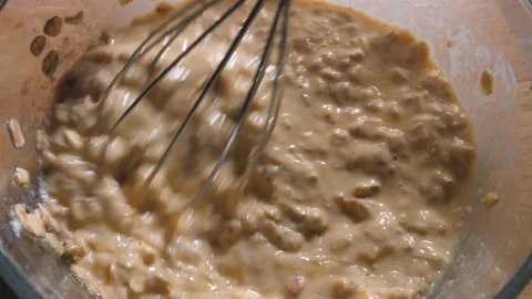 Mixing a mixture of oatmeal, eggs, cheese and milk in a glass bowl 스톡 동영상 166356371