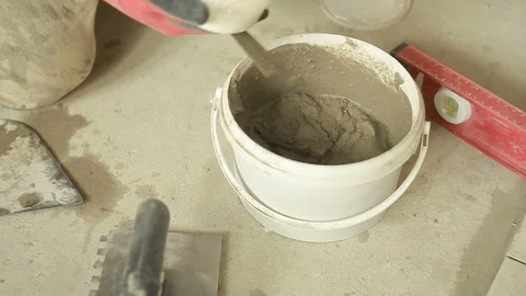 Mixing mortar in a bucket Stock-Footage 88860716