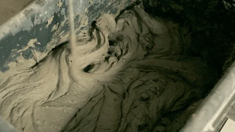 Mixing mortar in a bucket Stock Footage 94425850