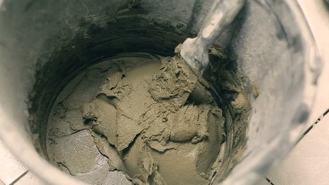 Mixing mortar in a bucket Stock Footage 99104676