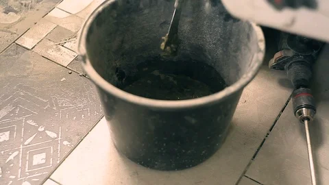 Mixing mortar in a bucket Stock Footage 99106903