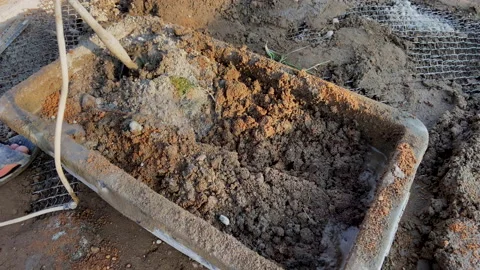 Mixing mortar with a mixer. Cement mortar mix. Mortar consists Video stock 218552833