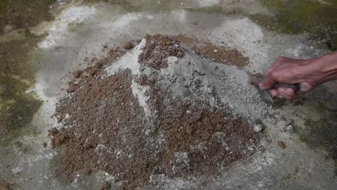 Mixing mortar or cement mixture in close-up Stock Footage 300930079