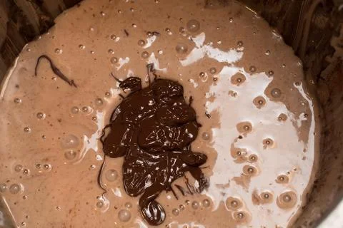 Mixing the necessary ingredients to make a chocolate cake ready to be beaten Stock Photos