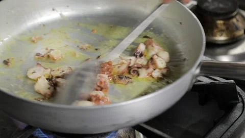 Mixing Octopus in a Pan Stock Footage 86244836