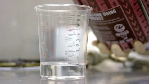 Mixing paint in a lab, close Stockbeeldmateriaal 78428343