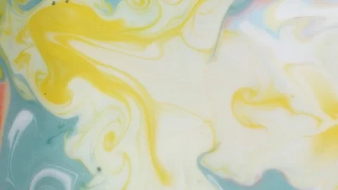 Mixing paints in milk. Stock Footage 75584687