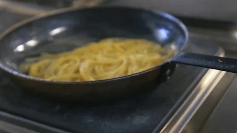 Mixing the paste on the pan Stock Footage 77480757