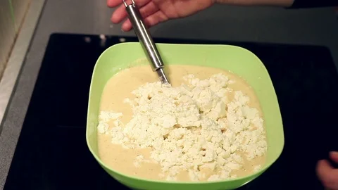 Mixing pastry for cornbread muffins Stock Footage 127084552