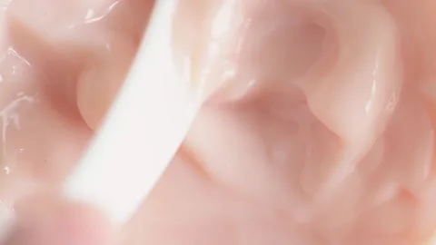 Mixing pink jelly bubble face mask close-up, macro. Skincare product Stock Footage 152697507