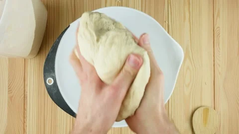 Mixing pizza dough flat lay overhead on a wooden table Vidéo 134200264
