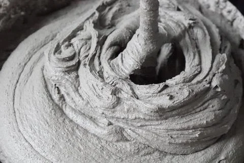 Mixing of a plaster solution by an electric drill. Home renovation Photos