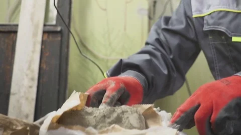 Mixing of a plaster solution by manual method . Home renovation Stock Footage 88687859