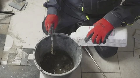 Mixing of a plaster solution by manual method . professional builder Video stock 88688159