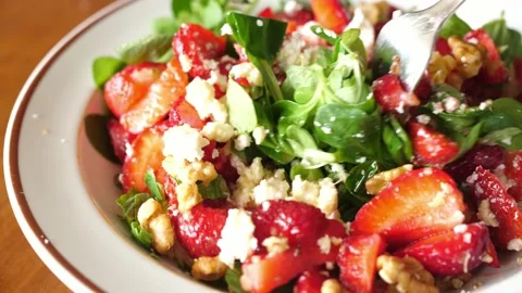 Mixing preparing summer fresh salad lamb's lettuce, strawberries ricotta cheese Stock Footage 134287551