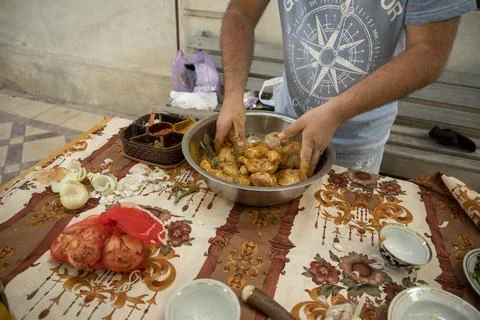A mixing process of chicken with spices Fotos Stock