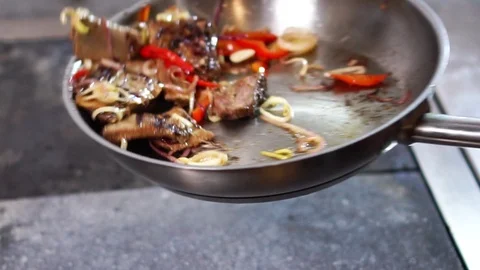 Mixing process of delicious pork ribs meat slices with fresh spicy vegetables on Stock Footage 106812350