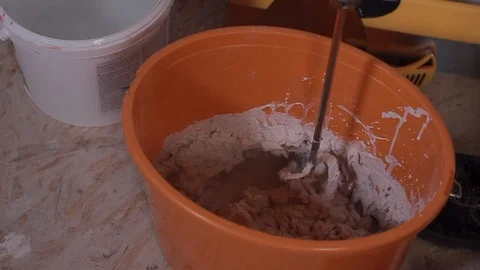 Mixing Putty Mixture For Construction Stock Footage 101317177