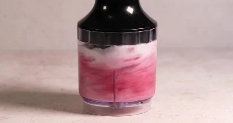 Mixing raspberry and milk in blender smoothy preparation Stock Footage 194105017