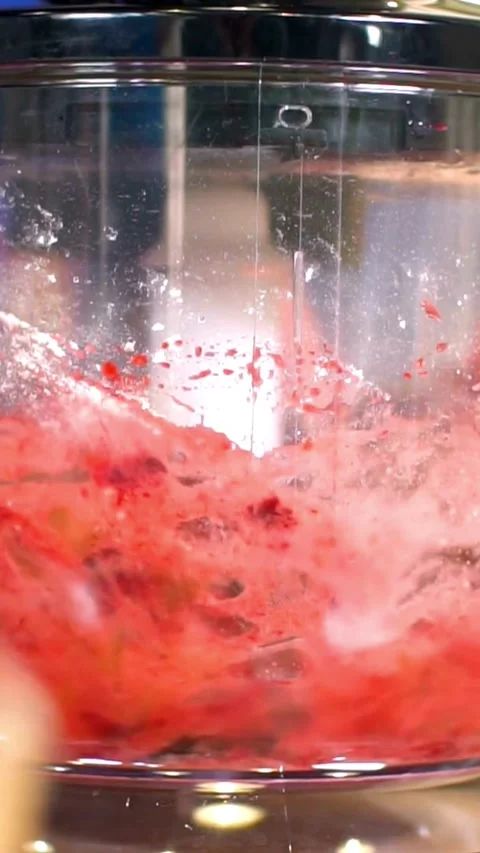 Mixing red fruit and white powder in food processor Stock Footage 334169767
