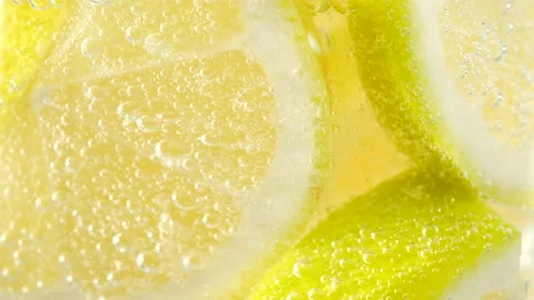 Mixing refreshing drink Lemon and sparkling water with ice Stock Footage 135105400