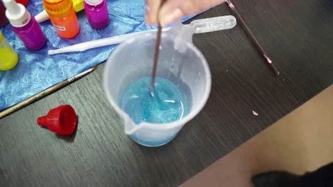 Mixing soap base with the colored tastes Stock Footage 74360401