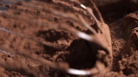 Mixing of the solid rolling cocoa powder, highlighted, slow motion( macro close Stock Footage 86490861