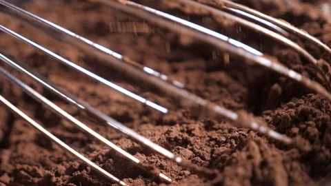 Mixing of the solid rolling cocoa powder, highlighted, slow motion( macro close Stock Footage