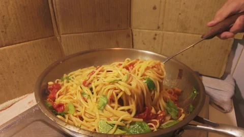 Mixing Spaghetti, Tomato Sauce and Beef in a Frying Pan Stock Footage 344670109
