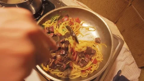 Mixing Spaghetti, Tomato Sauce and Beef in a Frying Pan Stock Footage 344670207