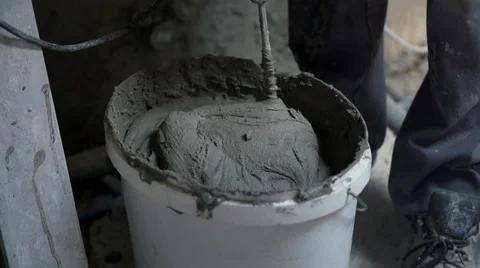 Mixing special glue with drilling machine Stock Footage 39385754
