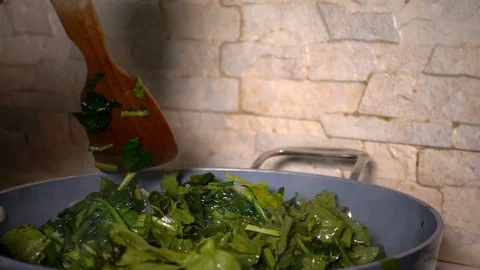 Mixing Spinach with Oil Stock Footage 104899025