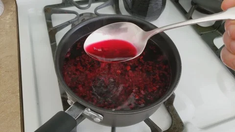 Mixing with spoon prepared basic Borscht or red beet soup Stock Footage 103192165