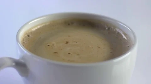 Mixing Sugars Into A Cup Of Coffee 動画素材 75645454