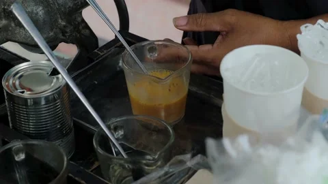 Mixing Thai milk tea Stock Footage 207402593