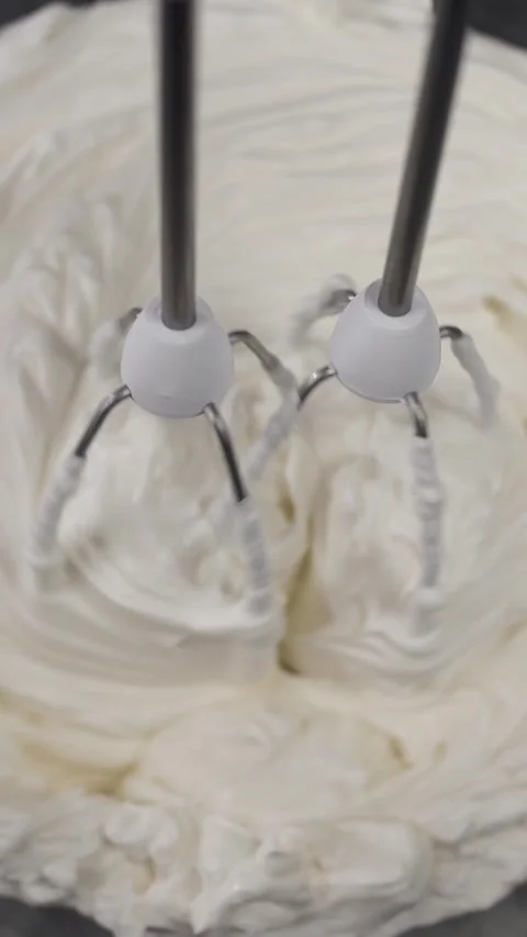 Mixing their chicken egg mousse to make tiramissou cake. Stock Footage 281668364