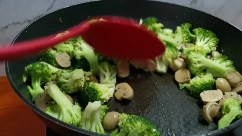 Mixing Vegetables in a Frying Pan Stock Footage 234882544