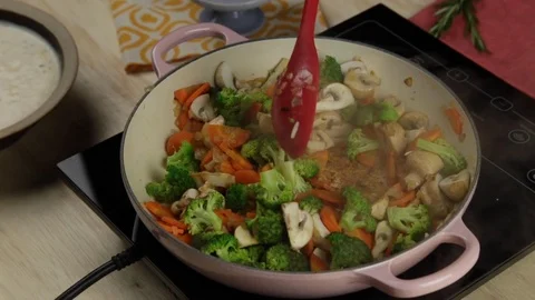 Mixing vegetables with a spoon Stock Footage 118020255